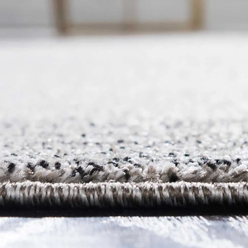 Teppich in Hellgrau mit dunkelgrauem Rand - Armina